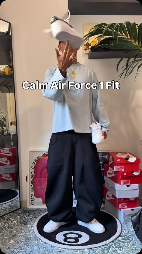 Instagram post by @jp.garcia for Nike Sportswear. Caption reads: @nikesportswear calm air force 1 fit #TeamNike AD.