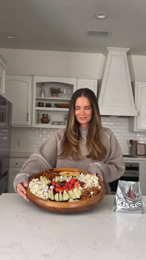 Instagram post by @britt_horton for HERSHEY'S Chocolate. Caption reads: After-school tea time might just be my favorite....