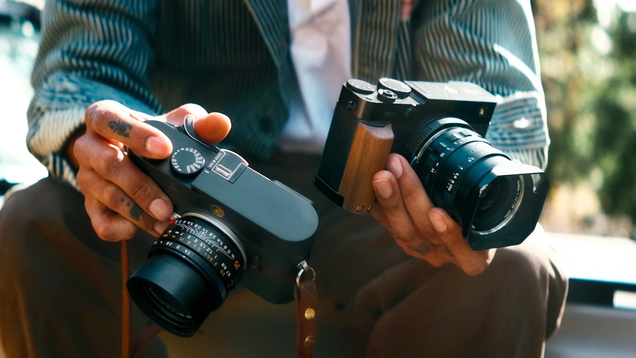 YouTube post by @cammackey for B&H Photo Video. Caption reads: Leica EV1 VS Fujifilm XE5 | EVF Rangefinders.