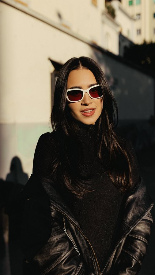 Instagram post by @aboutclo for Marcolin. Caption reads: enjoying the sun
in my @maxandco sunnies....