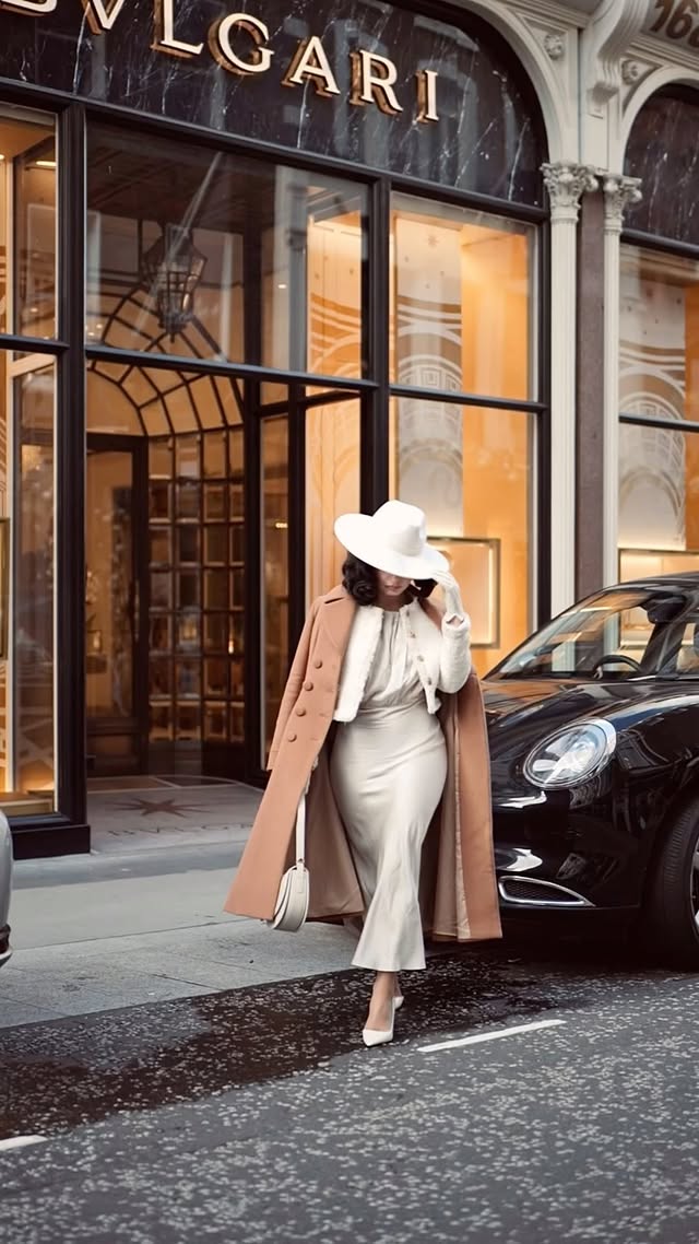 Instagram post by @lira__karina for SILK MAISON. Caption reads: [...] London ❄️🥂 Coat @ruthnmathise Dress....