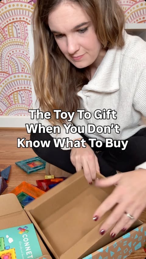 Instagram post by @earlyemotions for Connetix Tiles. Caption reads: Comment BUILD and I’ll send you the....