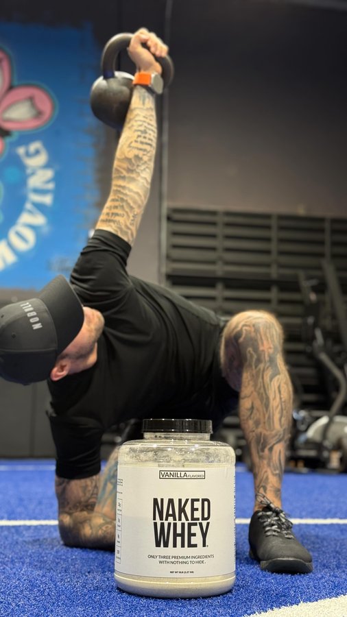 Instagram post by @dr.zachcolls for NAKED nutrition. Caption reads: 💪 NAKED NUTRITION 💪 😤 Train hard, recover [...].