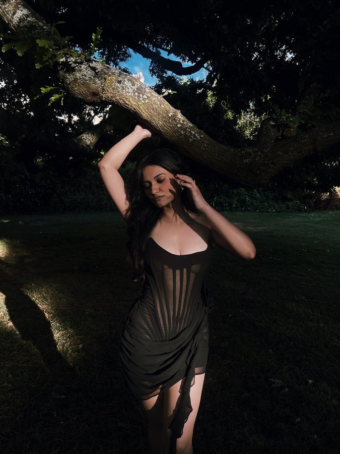 Instagram post by @na.ndini for Heiress Beverly Hills. Caption reads: [...] else’s gaze❤︎. ݁₊ ⊹ 
Dress:....