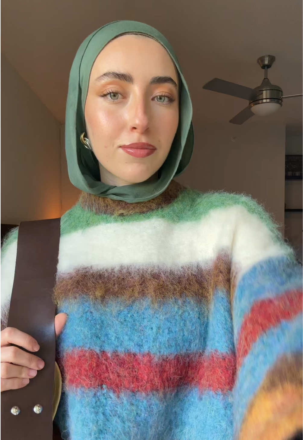 TikTok post by @mariam.kudsi for Topshop. Caption reads: This is the perfect fall sweater  @TOPSHOP TOPMAN....