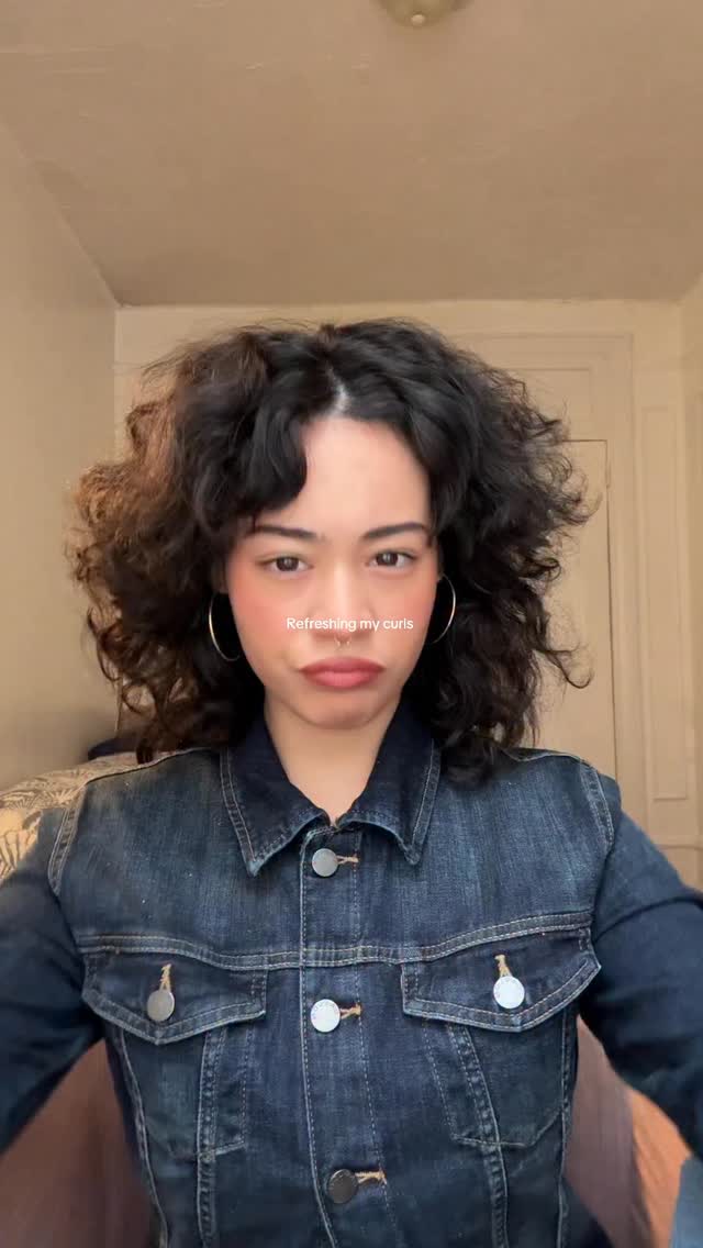 Instagram post by @tiffanylovesherbed for OUAI. Caption reads: Refreshing my hair with @theouai #reels....