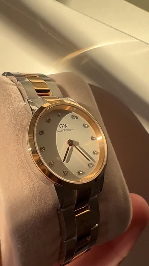 Instagram post by @alexandra_petram for Daniel Wellington. Caption reads: Timeless beauty from @danielwellington Save 25%....