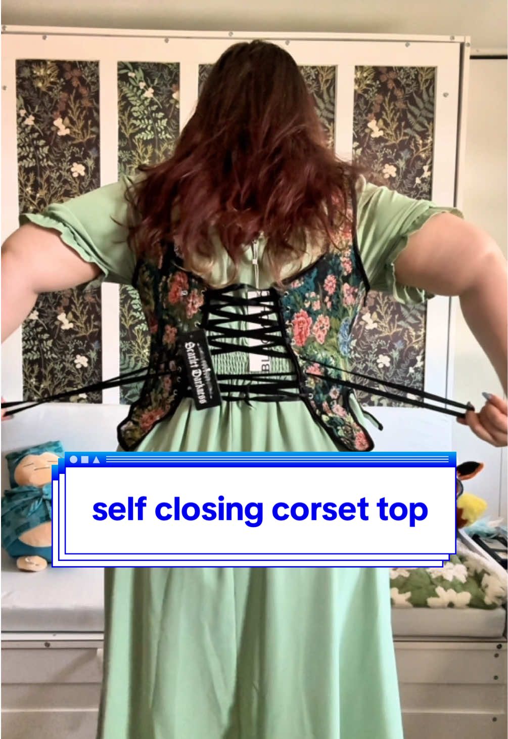 TikTok post by @zoe.theartist for Scarlet Darkness. Caption reads: i am locked into this corset from @Scarlet....