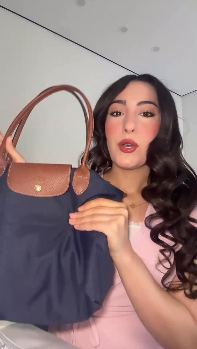 Instagram post by @z.k.martist for Longchamp. Caption reads: توبي ما بتوب😂😂😂😂😂
#العراق #بغداد....