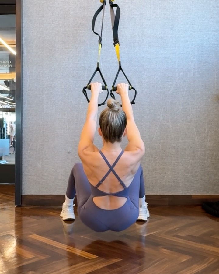 Instagram post by @taralynemerson for Buffbunny Collection. Caption reads: Who needs armor when you’ve got a bodysuit and TRX....