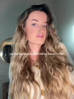 TikTok post by @calliekaye__ for Divi Scalp & Hair Health. Caption reads: @DIVI from thin to THICK. #thinninghair #hairserum....