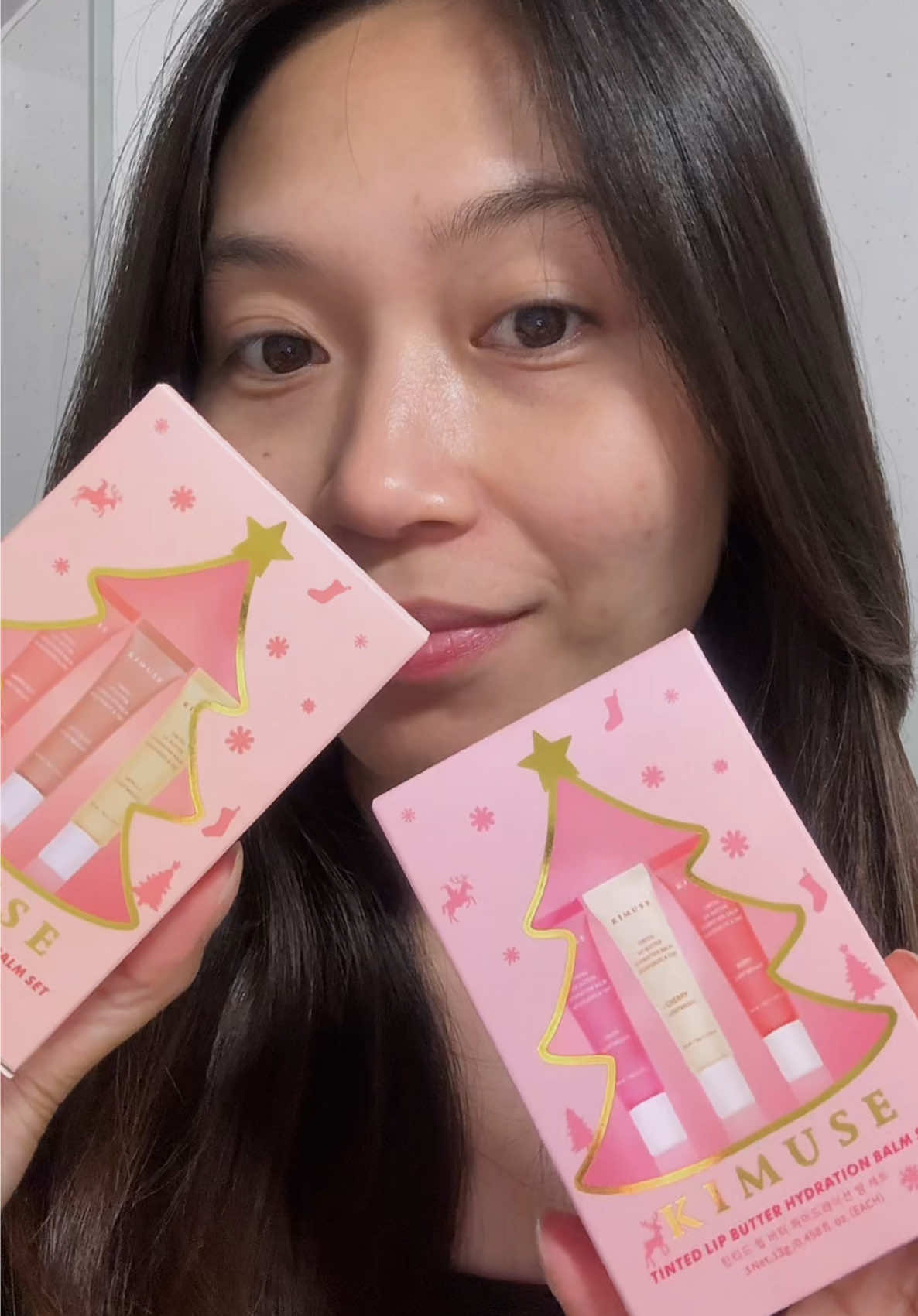 TikTok post by @ugcwithlourdes for Kimuse. Caption reads: ✨ Swatching the KIMUSE Tinted Lip Butter Balms ✨....