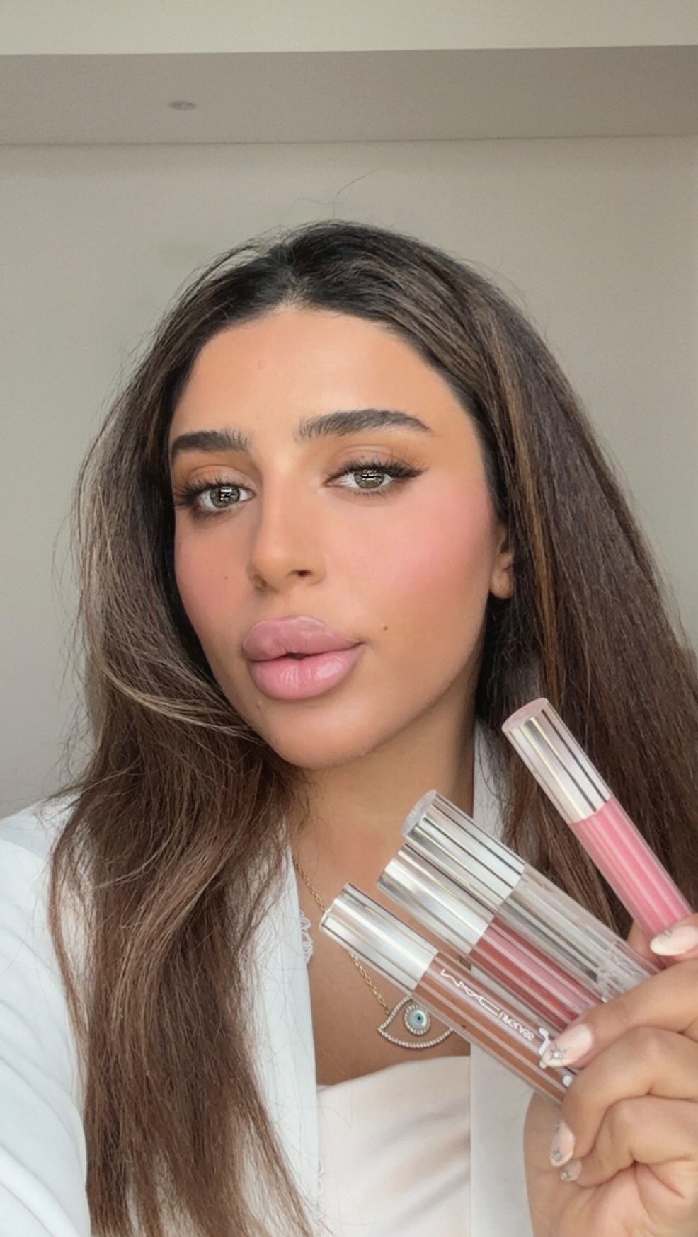 Instagram post by @3asalbeauty for Namshi. Caption reads: Testing the new 💋 MAC Lipglass Collection like a....