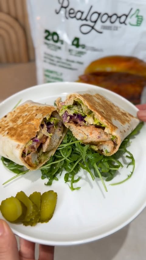 Instagram post by @afamilyedit for Real Good Foods Co.. Caption reads: Quick, easy, and so satisfying 🌯✨ For this wrap,....