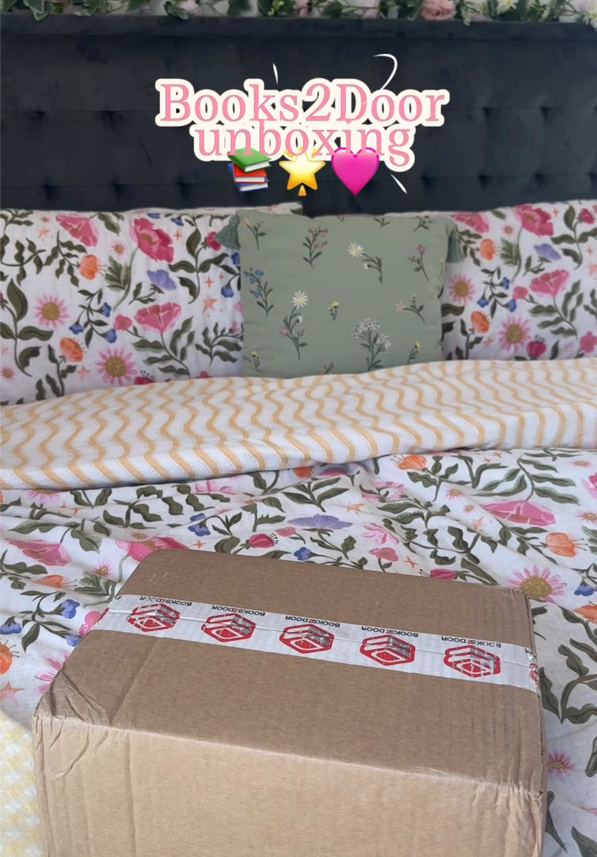 TikTok post by @e.louise25 for Books2Door. Caption reads: @Books2Door unboxing 📚 🌟AD/GIFTED🌟 Thank you so....