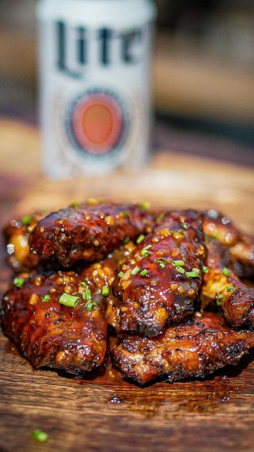 Instagram post by @tfti.bbq for Miller Lite. Caption reads: 𝘽𝙚𝙚𝙧 𝘽𝙧𝙞𝙣𝙚𝙙 𝙎𝙢𝙤𝙠𝙚𝙙 𝘾𝙝𝙞𝙘𝙠𝙚𝙣....