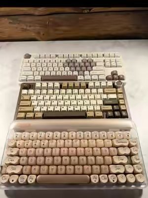 TikTok post by @thecoultercoop for Lofree. Caption reads: [...] a cozy, creamy keyboard 🧸⌨️🤎 #aula....