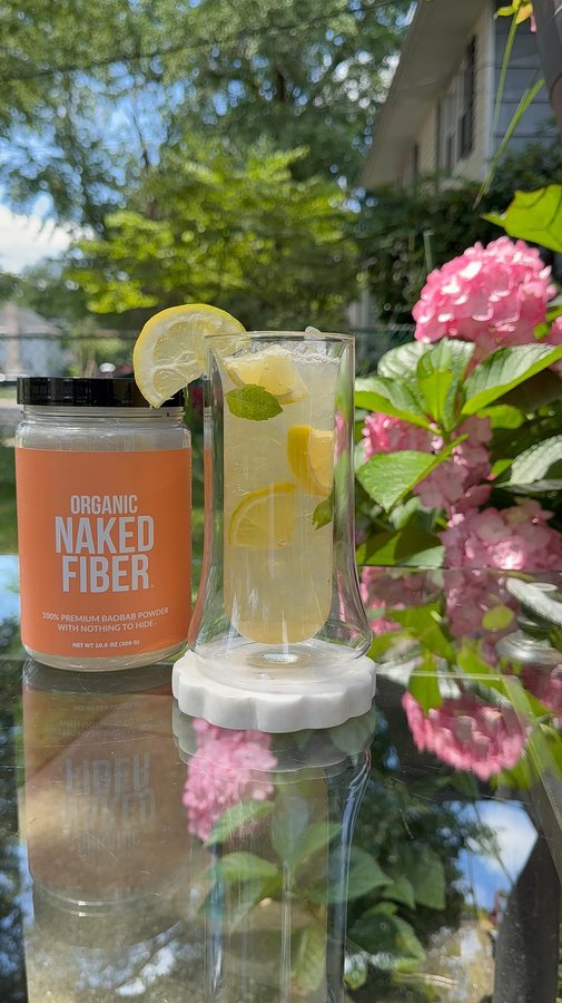 Instagram post by @lifestylebyanju for NAKED nutrition. Caption reads: [...] and a scoop of @nakednutrition Organic Naked....