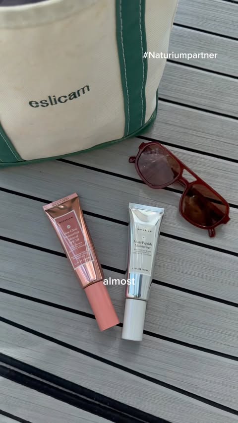 Instagram post by @eslicam for Naturium. Caption reads: sunny Florida days = @naturium in the boat bag....