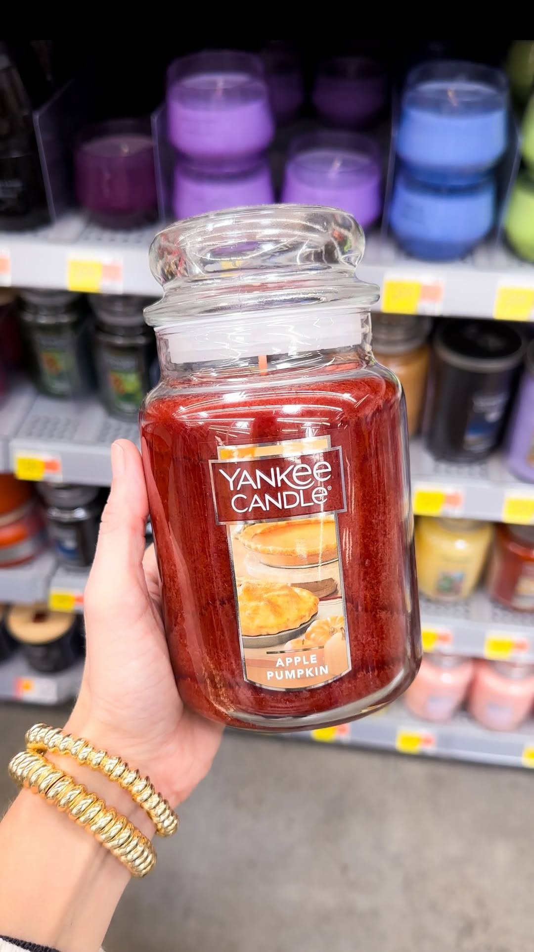 Instagram post by @walmartbargains for Yankee Candle. Caption reads: Fall fragrance alert, candle lovers! 🕯️🍁 #ad The....