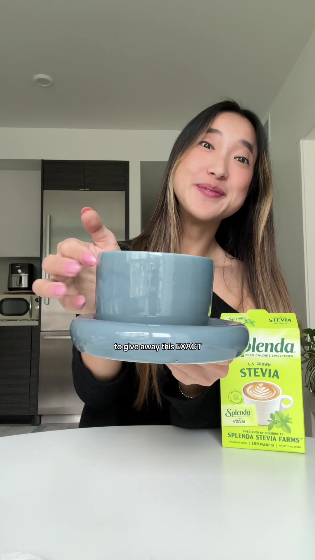 TikTok post by @emmezhou for Splenda. Caption reads: Enjoying my coffee with @Splenda in a cute mug is....
