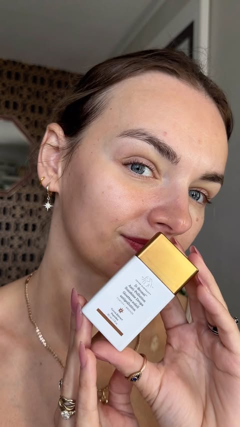 Instagram post by @angelai10000 for Drunk Elephant. Caption reads: A few drops of Drunk Elephant D-Bronzi and my skin....
