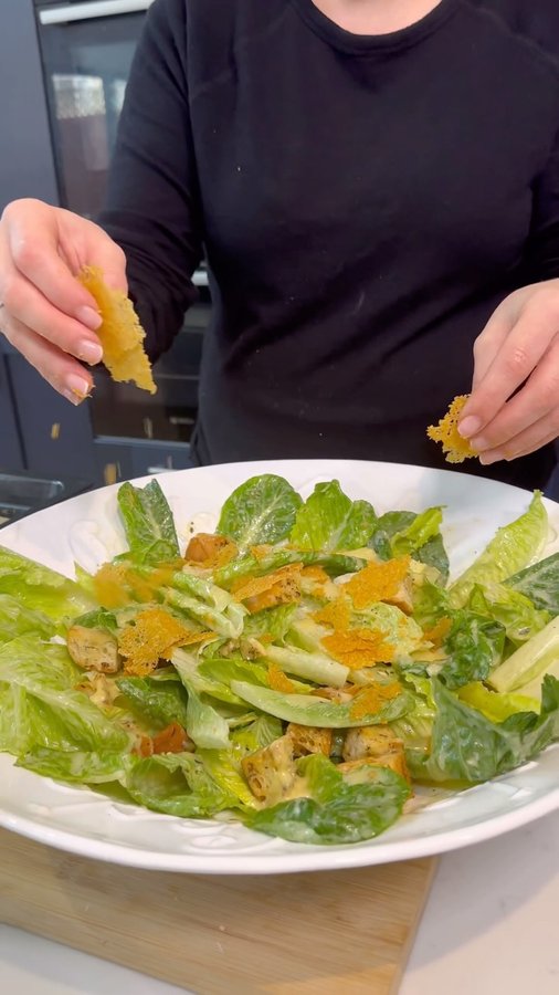 Instagram post by @gabriellas_kitchen for Parmigiano Reggiano. Caption reads: Caesar salad is a timeless classic for a reason,....