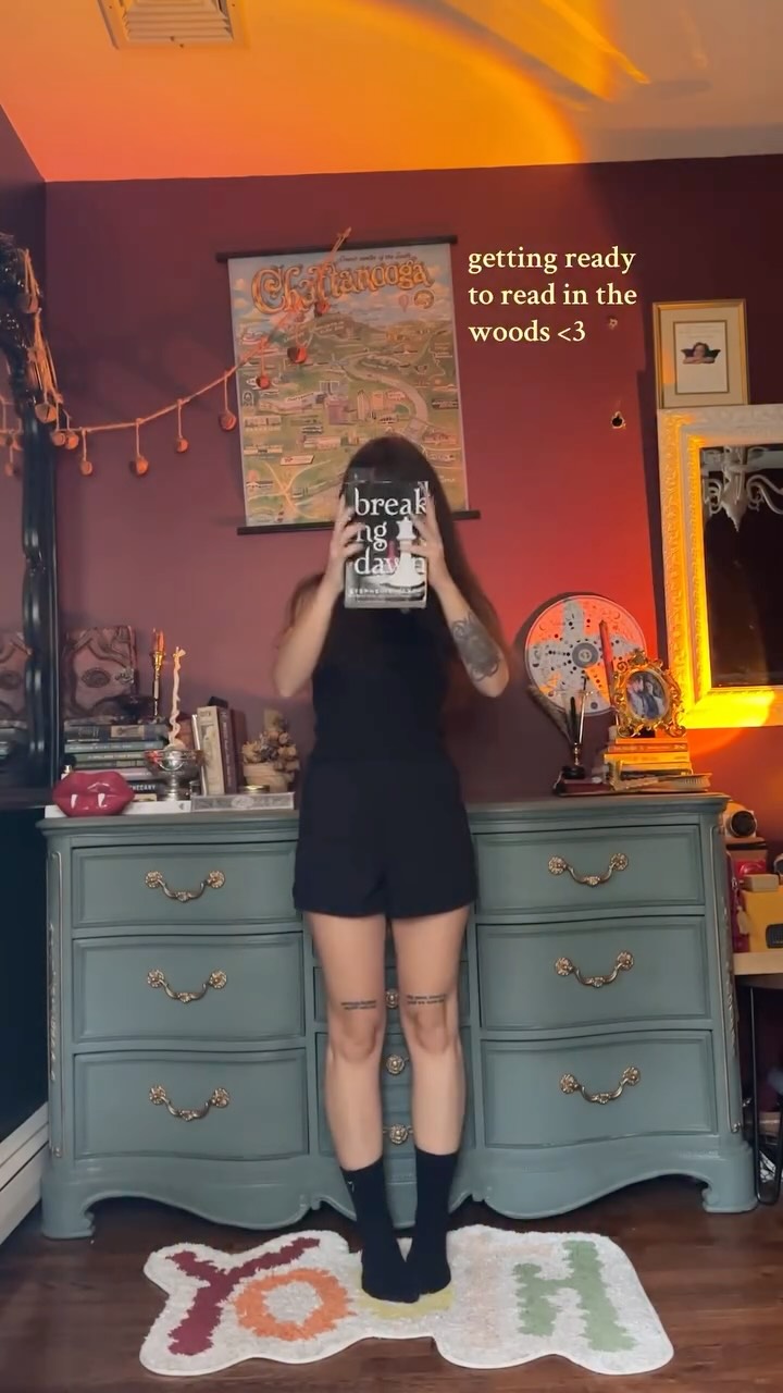 Instagram post by @biancaellob for Alpha Industries. Caption reads: cozy, fall reading day w/ @alphaindustries 🤎🍂....