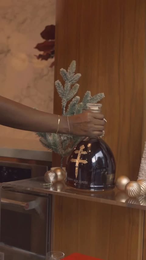 Instagram post by @thedessyrayway for D'USSE Cognac. Caption reads: [...] pour into you this holiday season 🥂✨....