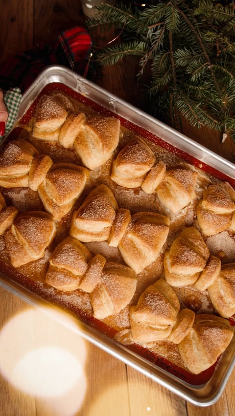 Instagram post by @northwoodsfolk for King Arthur Baking Company. Caption reads: Bow buns are fun, festive, and can be made either....