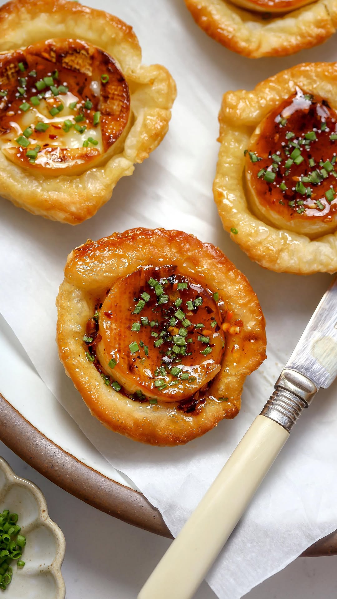 Instagram post by @foodmymuse for Chateau Ste. Michelle Winery. Caption reads: Holiday Series: Brie Upside Down Bites & Truffled....