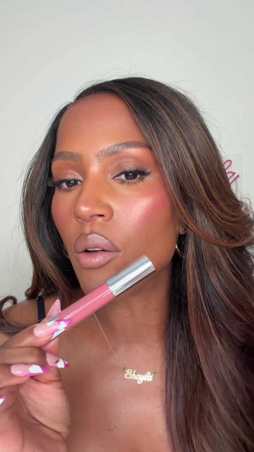 TikTok post by @makeupshayla for Clinique. Caption reads: [...] thing chubby are my lips! The ICONIC....