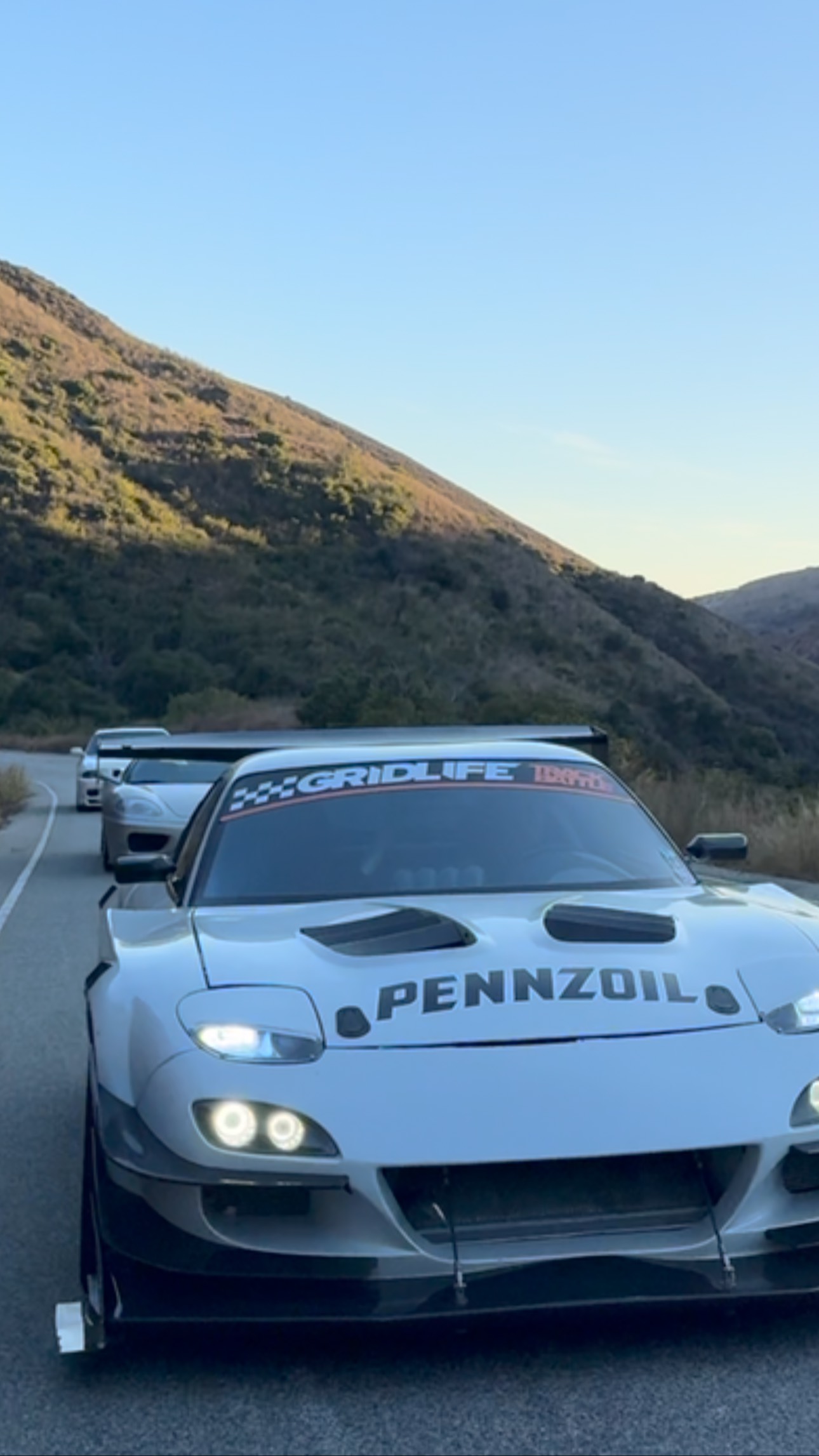 Instagram post by @jonny.grunwald for PENNZOIL. Caption reads: Cruising with the @pennzoil boys…....