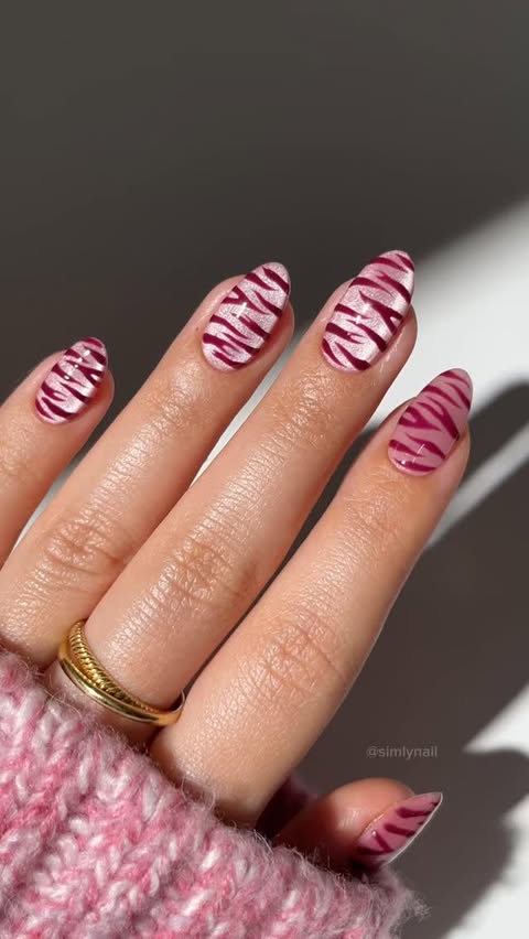 Instagram post by an influencer for MYLEE | AT-HOME GEL NAILS. Caption reads: ad • pink cat eye zebra nail inspo🥹🎀🦓✨ using....