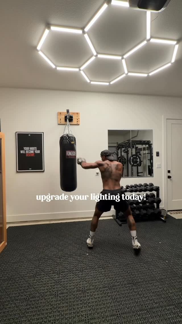 Instagram post by @carlosdharrisjr for Enbrighten. Caption reads: Upgrading my home gym lighting with....