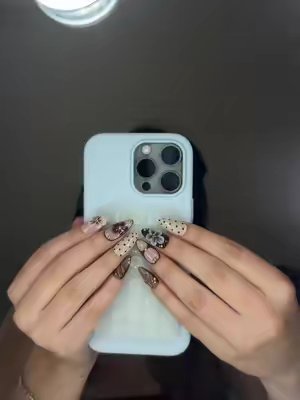 TikTok post by @floraalvarezz for Ersa Nails. Caption reads: literally love so much ✨🤎@Ersa Nails #ersanails....