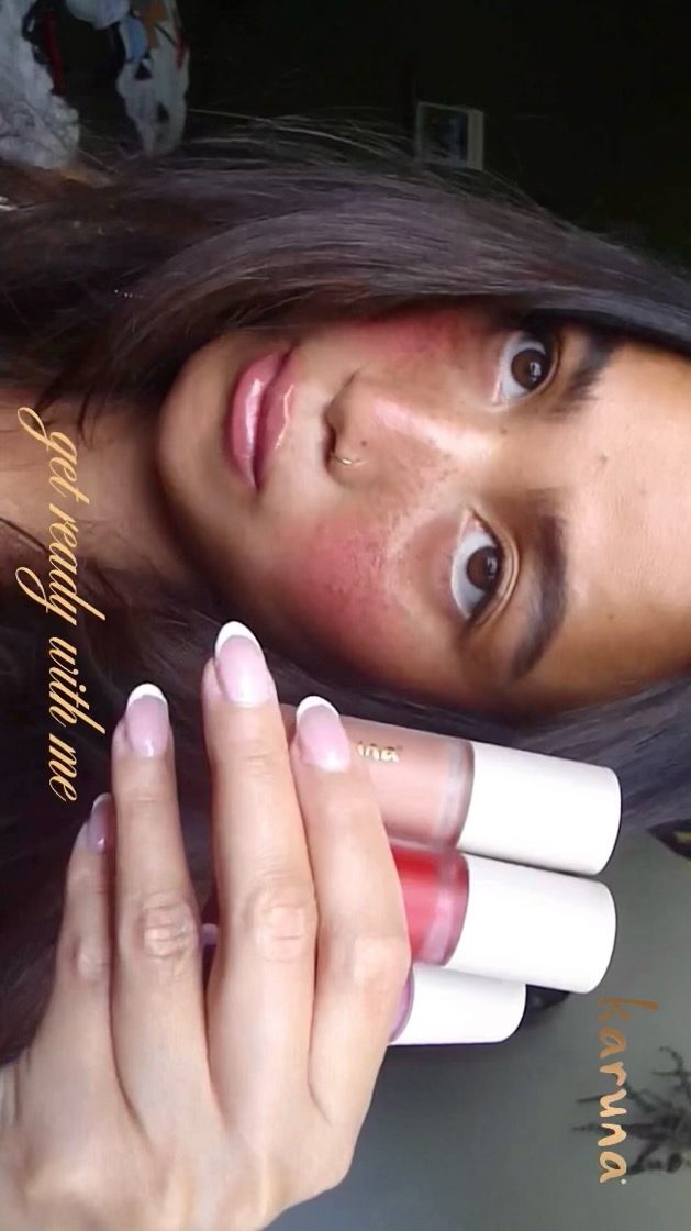 Instagram post by @juliennecaryl for Karuna Skin. Caption reads: Meet your new lip essential: @karunaskin’s lip....