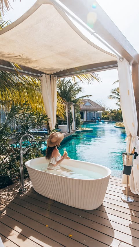Instagram post by @travelwithtalia for Sandals Resorts. Caption reads: [...] how blue the water was here… 💙🌊✨....