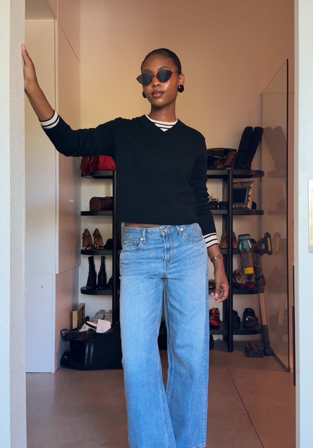 TikTok post by @livinglauryn for Everlane. Caption reads: looking timeless this fall 🍂 @Everlane....