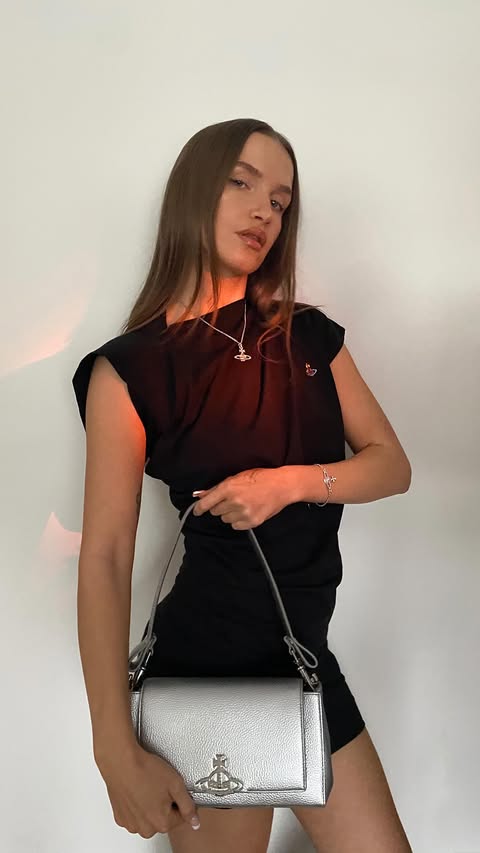 Instagram post by @natwinter_ for Vivienne Westwood. Caption reads: my kinda dress 🤭 @flannels @viviennewestwood ad.
