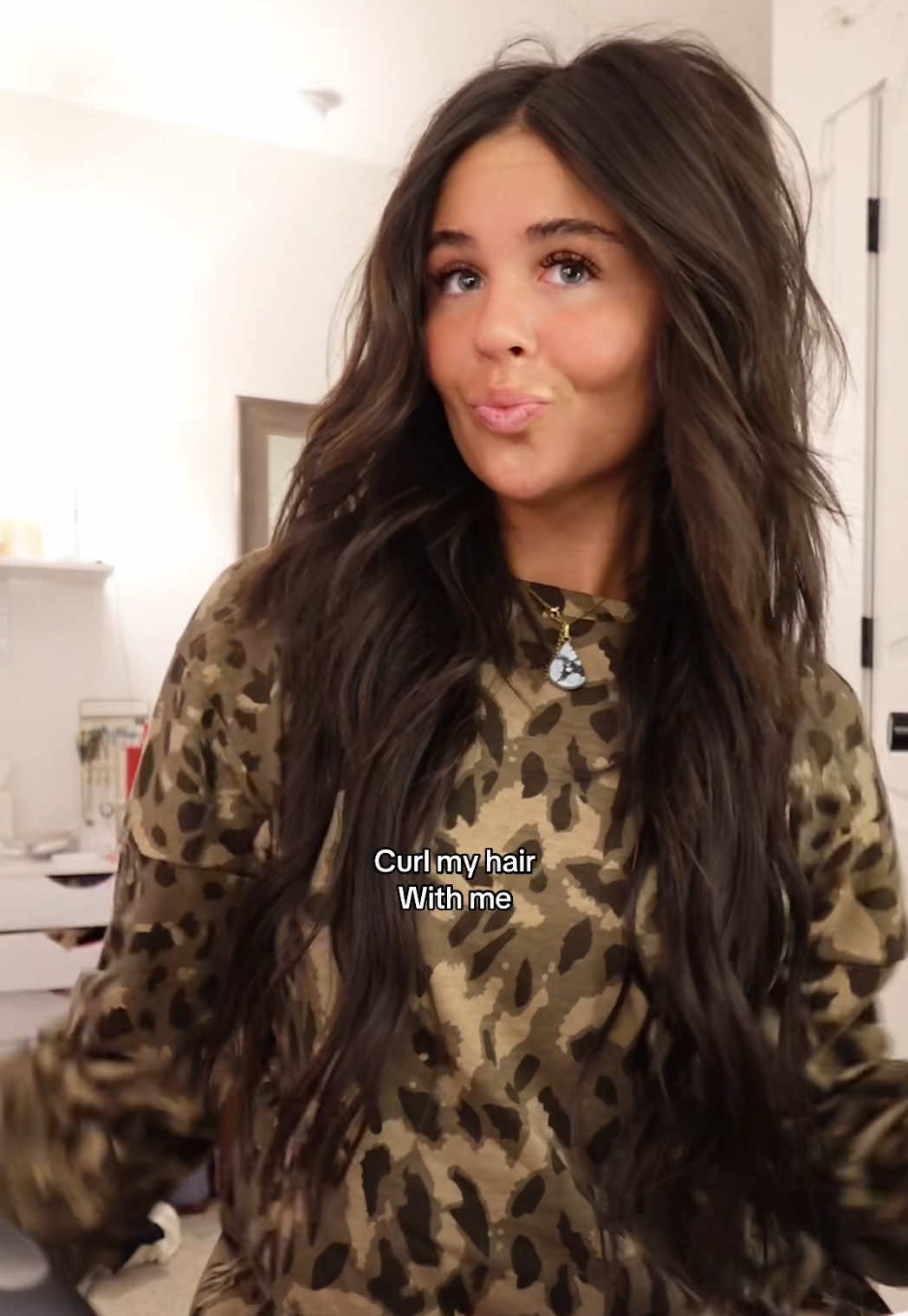 TikTok post by @lifewjilli for Bio Ionic. Caption reads: The @Bio Ionic curling iron is worth the hype....