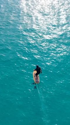 Instagram post by @iamdaskalo for Fliteboard. Caption reads: 242/365 🏄‍♂️🇸🇽🌅 How beautiful would it be to....