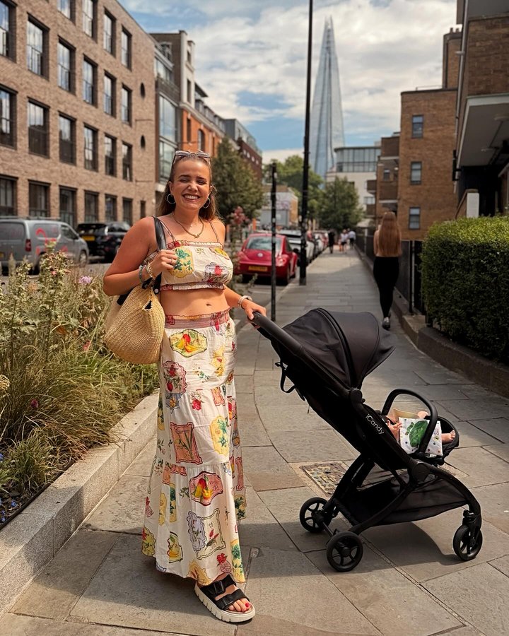 Instagram post by @em_clarkson for iCandy World Belgium. Caption reads: Sunny (sweaty) commutes with my baby girl. AD. I’m....