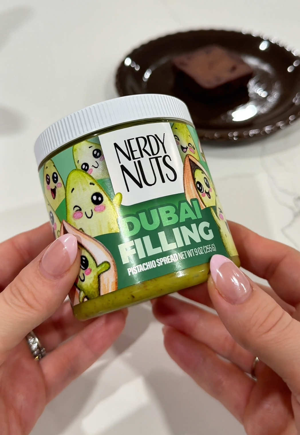 TikTok post by @nic_51122 for Nerdy Nuts. Caption reads: [...] my daily Dubai chocolate fix with @Nerdy....