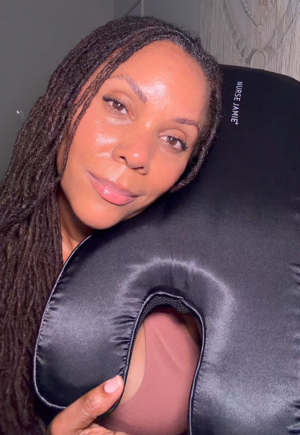 TikTok post by @beachbumwisdom for Nurse Jamie. Caption reads: Using @Nurse Jamie ‘s Beauty Bear skincare pillow....