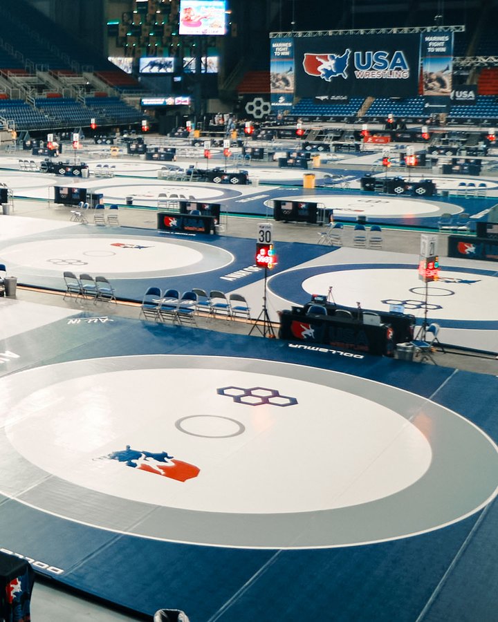 Instagram post by @usawrestling for RUDIS. Caption reads: Sacred Ground. Honored to partner with @dollamur....