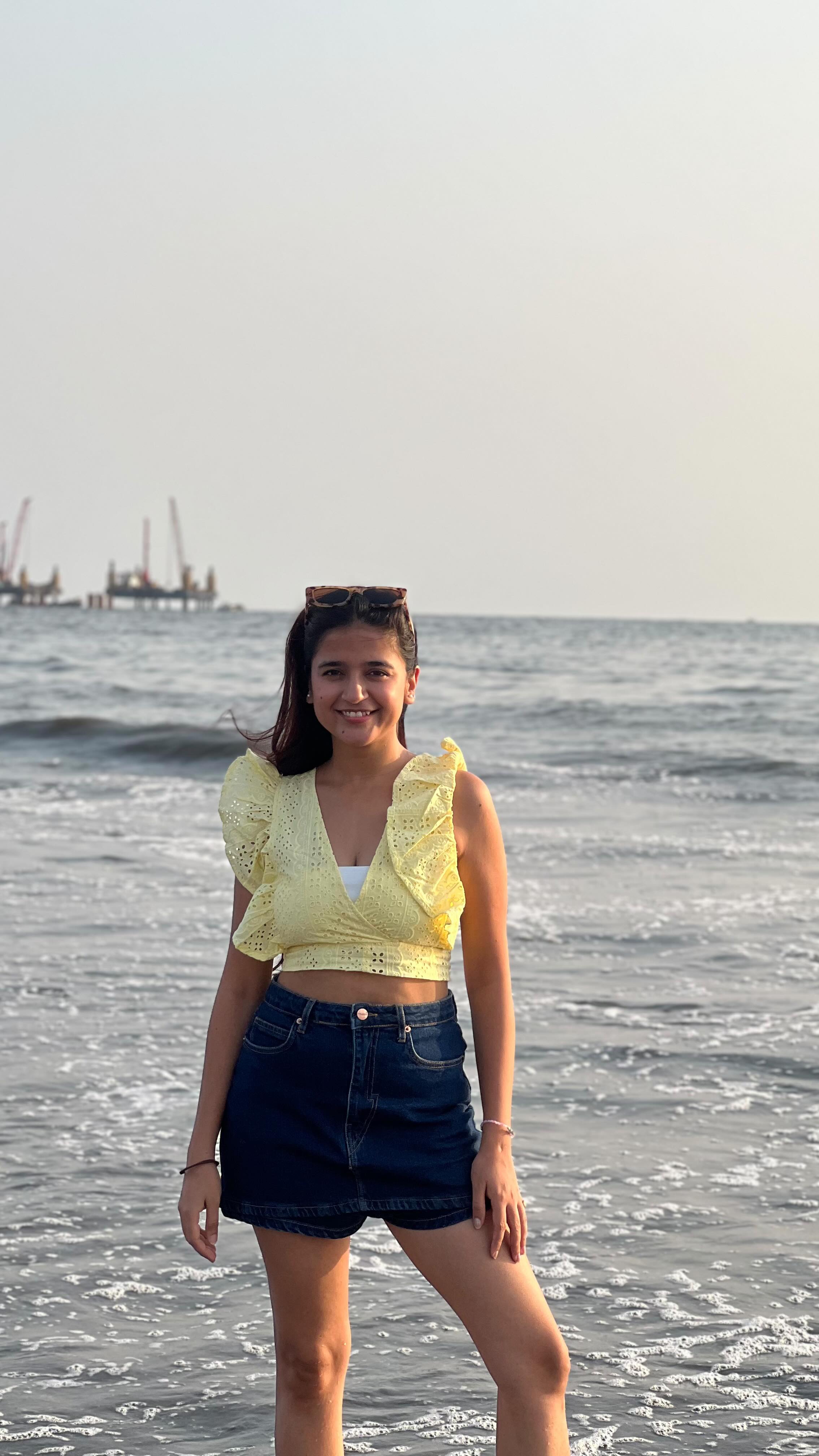 Instagram post by @vishakhapandey510 for WishCare. Caption reads: Just me, the beach, and SPF vibes only—because....