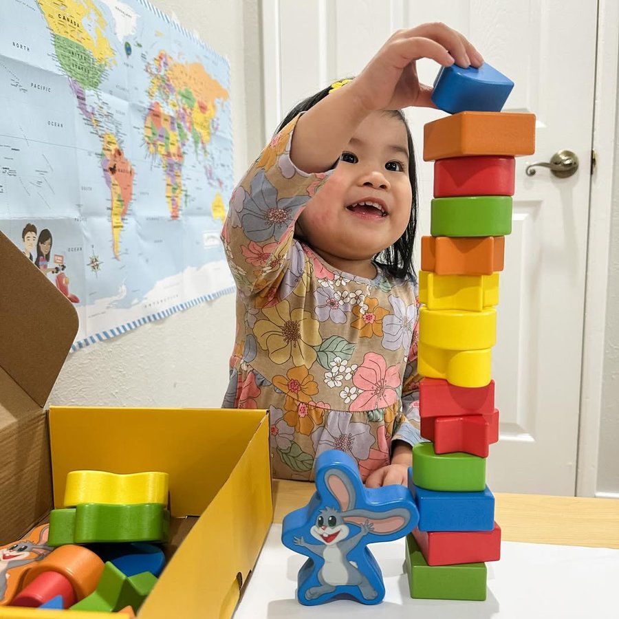 Instagram post by @junebabylove for SimplyFun. Caption reads: #ad My toddler is loving the @simplyfun My Fun Set....
