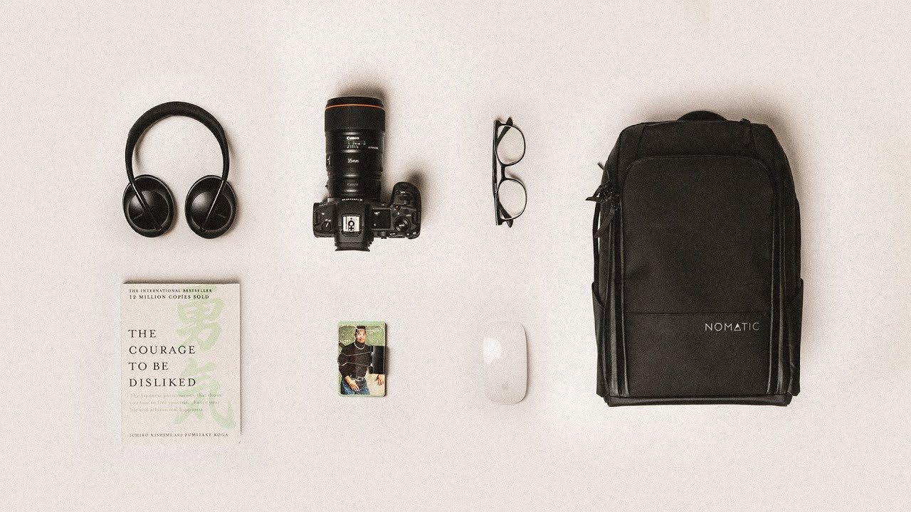 YouTube post by @mattdavella for NOMATIC. Caption reads: My minimalist travel organization system.