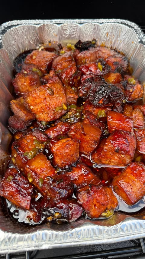 Instagram post by @cooking_with_fire___ for Pit Boss Grills. Caption reads: [...] Belly Burnt Ends low and slow on the....